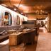 Hotel Stubaierhof lounge in Neustift im Stubaital with rustic wood decor, seating, and wall-mounted TV