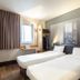 B&B HOTEL Paris Nord Villepinte twin room in Villepinte with two single beds and a city-view window