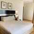 Seri Bukit Ceylon Suites Bukit Bintang in Kuala Lumpur bedroom with king bed and bedside lamps