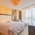 Beijing Rishengchang Hotel room in Beijing with king bed, chaise lounge and city-view window