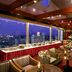 Hotel Nikko Tsukuba in Tsukuba rooftop lounge with city skyline view and candlelit tables