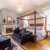 Bourbon Manor Bed & Breakfast Inn Bardstown suite with four-poster bed, fireplace, and seating area