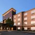 La Quinta Inn & Suites by Wyndham Montgomery exterior with covered entrance and parking area in Montgomery
