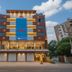 Fabhotel Rajnandani Residency in Indore, exterior facade with illuminated entrance at dusk