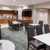 Residence Inn by Marriott South Bend Mishawaka breakfast area with tables, chairs, and kitchenette