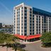 Sheraton Lincoln Harbor Hotel in Weehawken exterior with riverfront view and trees