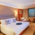 Yiwu Hotel (International Trade City) in Jinhua: guest room with large bed and city view