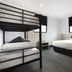 Nightcap at St Albans Hotel room with bunk bed, double bed, and two windows in Saint Albans
