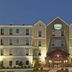 Staybridge Suites Bentonville - Rogers By IHG exterior in Rogers, lit hotel entrance at night