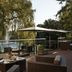 Outdoor terrace at Hilton Frankfurt Gravenbruch in Neu Isenburg with pond views and wicker seating