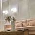 Abalu Boutique & Design Hotel Madrid lounge with blush sofa, marble coffee table and wall sconces