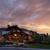 Waldorf Astoria Park City exterior at sunset with mountain-lodge architecture and landscaped grounds