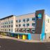 Tru by Hilton Clearfield Hill Air Force Base exterior in Clearfield with parking lot and mountain backdrop