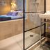 Hôtel La Casa Pairal in Collioure, bathroom with glass shower beside a bedroom and bed