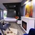 Çetinel Otel in Adana guest room with bed, fireplace, coffee table and colorful wall art