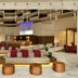 Embassy Suites by Hilton Phoenix Downtown North lobby with bar, seating area and illuminated ceiling in Phoenix