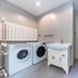 Home Inn Neo Lanzhou City Museum Dongfanghong Plaza Wanxiang City laundry room with washer, dryer and sink