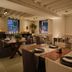 Sant Francesc Hotel Singular in Palma de Mallorca restaurant with set tables and warm lighting