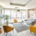 Lobby seating area at Appart'City Classic Genève - Gaillard with gray sofa, yellow chairs and plant