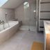 Hôtel Parc Adélie bathroom with soaking tub, walk-in shower, skylight and heated towel rail in Montagny-lès-Beaune
