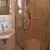 Zur Rotenfelsstube in Norheim bathroom with glass shower enclosure and wall-mounted sink