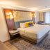 The Westfield Inn, BW Signature Collection guest room with king bed, window seating, and desk in Westfield