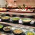 Asta Hotel Shenzhen buffet display with salads, sliced meats, and fruit in Shenzhen