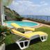 Vivenda Belo Horizonte in Caniço with terrace pool, sun loungers, and ocean view