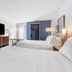 Spark by Hilton Harrisonburg University Area room with two beds, TV, desk and closet