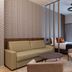 The Central Kirchberg - Smart Aparthotel in Luxembourg room with sofa, bed and floor-to-ceiling curtains
