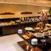 Hotel Luzeiros Recife buffet dining area with breakfast spread and fruit juices in Recife