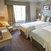 The Bluebird Inn at Samlesbury in Blackburn, twin guest room with window and patterned headboard