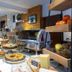 Hotel La Fontaine in Les Houches breakfast buffet with pastries, fruit, and cereal station