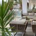 Hotel Antofagasta in Antofagasta with outdoor lounge seating beside a glass-railed pool terrace