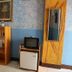 La Isla Bonita Resort in Boracay lobby with TV, mini fridge, shelf and framed mirror