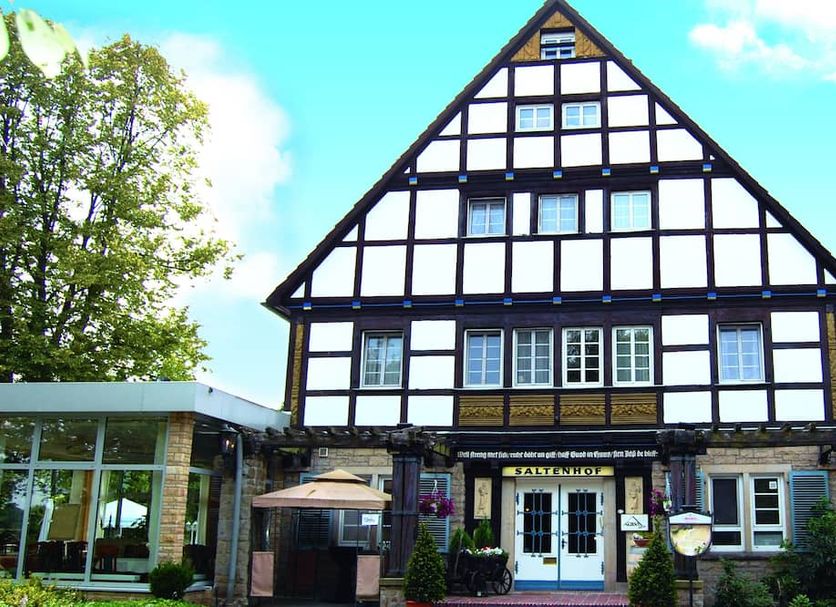 Hotel Saltenhof in Hoerstel with a traditional half-timbered facade and glass entrance