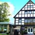 Hotel Saltenhof in Hoerstel with a traditional half-timbered facade and glass entrance
