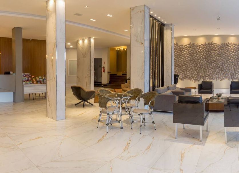 Hotel Vieira's in Balneário Camboriú lobby lounge with seating and marble floors
