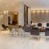 Hotel Vieira's in Balneário Camboriú lobby lounge with seating and marble floors