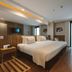 Pestana Rio Atlântica guest room in Rio de Janeiro with king bed and balcony ocean view