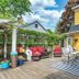 The Stella Rose B&B in Wolfville: outdoor patio with seating, table, pergola, and striped rug