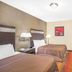 Howard Johnson by Wyndham North Bergen guest room with two beds and wall-mounted TV