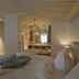 Bad Bubendorf Design & Lifestyle Hotel Bubendorf guest room with bed and mirrored vanity