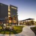 Hyatt Place South Reno in Reno with outdoor patio seating and landscaped courtyard at dusk