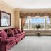 Traditions Hotel & Spa Johnson City suite with bay window view, sofa, desk and office chair