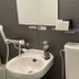 Hotel Route-Inn Saku Minami Inter bathroom with sink, mirror, and hair dryer in Saku