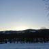 Gästehaus Klug in Sankt Stefan ob Stainz with snowy hills and a sunset sky