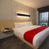 City Express Plus by Marriott Medellin Colombia room with bed and city view in Medellín