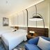 Nova M Olaya Hotel Edge By Rotana in Riyadh twin-bed guest room with modern lighting and city-view window