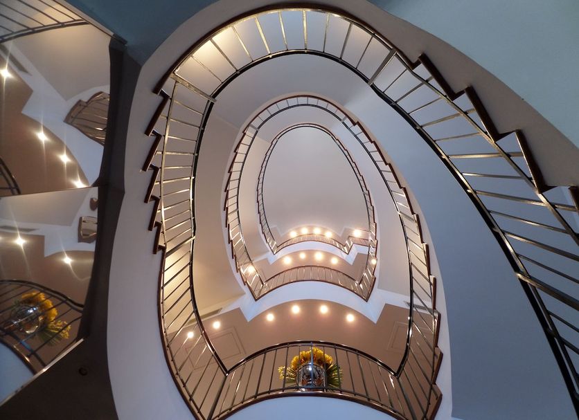 Albergo Del Sole in Porto Valtravaglia, spiral atrium view looking up multiple illuminated balconies